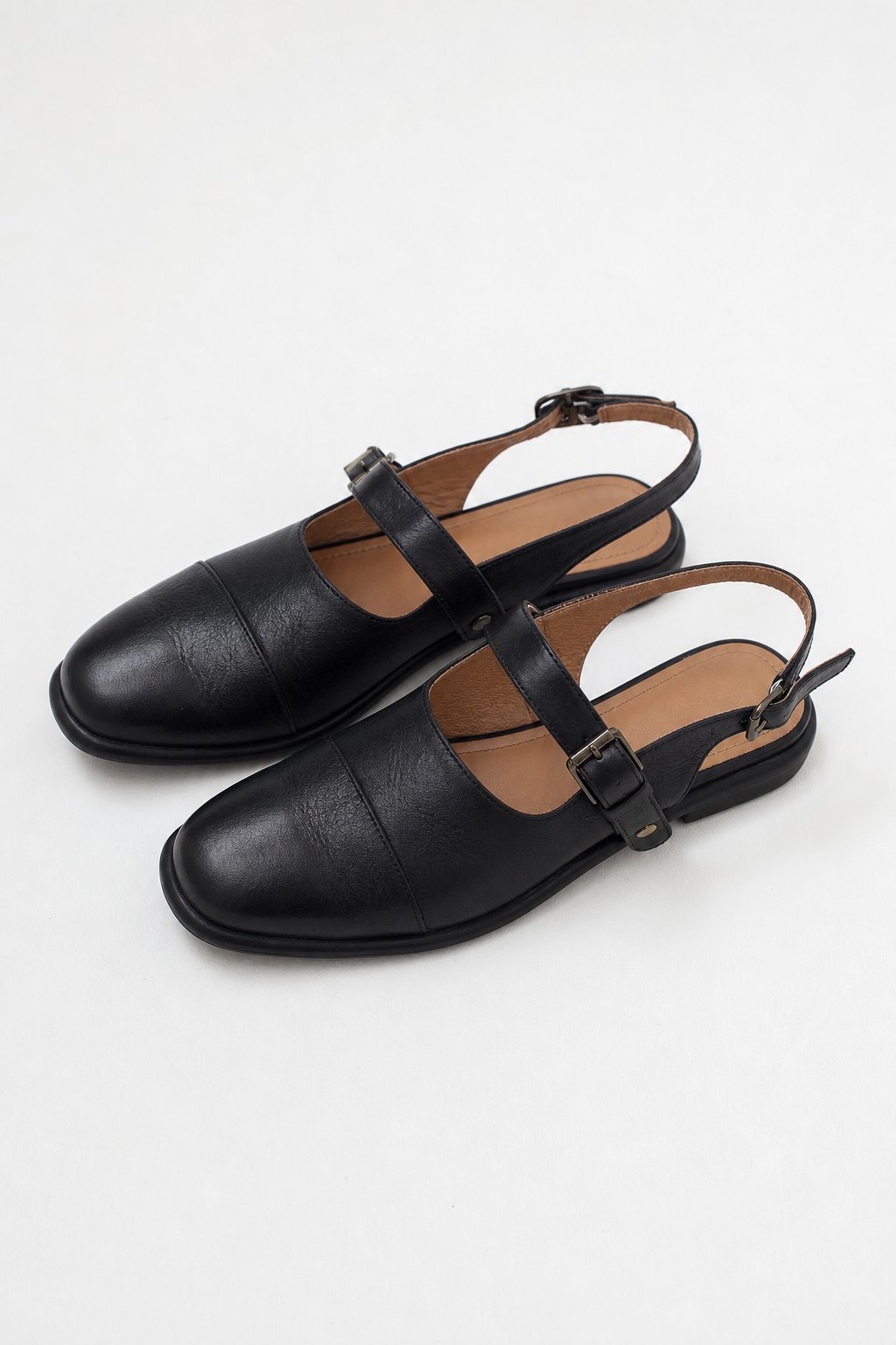 Positano Leather Slingback Flat Sandals — Black, studio product shot