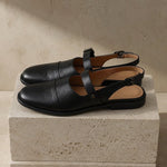 Positano Leather Slingback Flat Sandals — Black, studio product shot