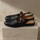 Positano Leather Slingback Flat Sandals — Black, studio product shot