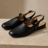 Positano Leather Slingback Flat Sandals — Black, studio product shot